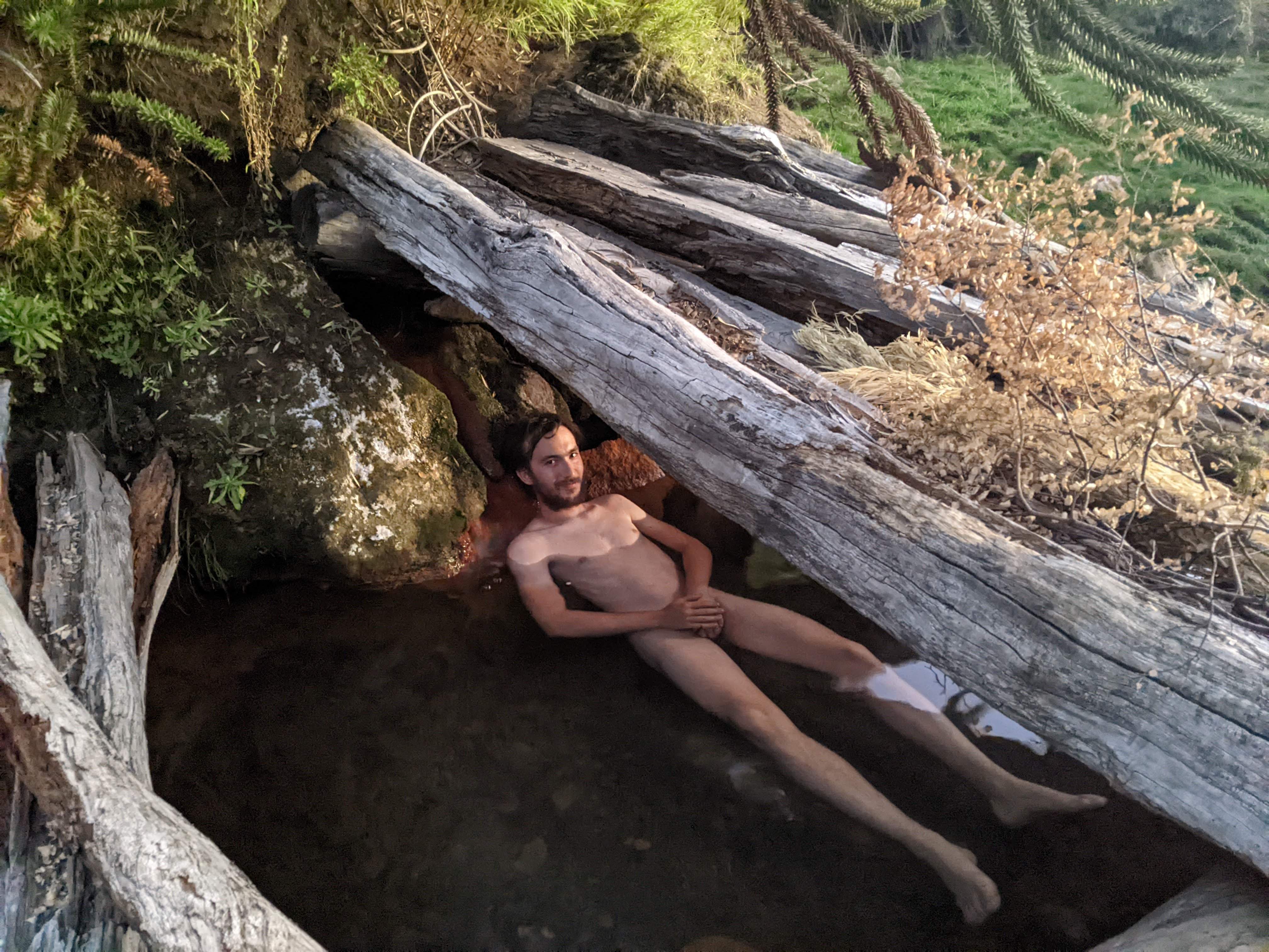 Alexis relaxing in a hot bath at Banos Coyucos